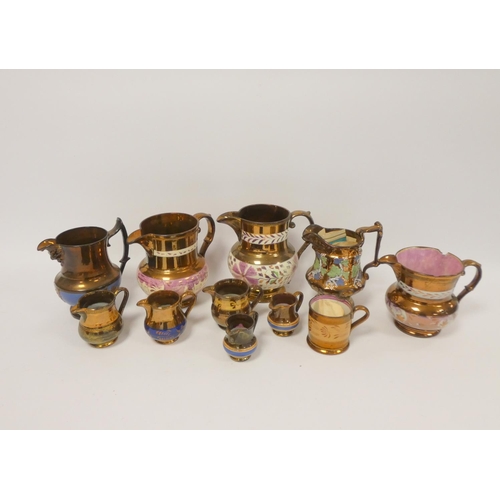 63 - Group of 19th century lustre jugs, various graduated sizes and styles, largest 17cm. (11)