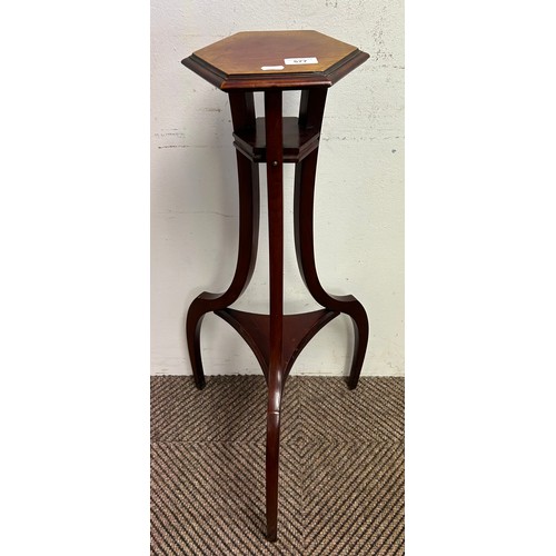 577 - Mahogany jardiniere stand of scroll form