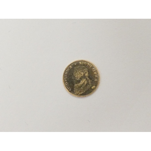 122 - Small 14ct gold 0.3 gram South African coin.