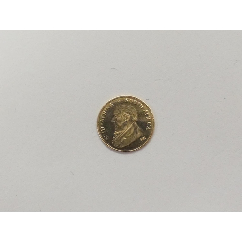 123 - Small gold 0.3gram South African 14ct gold coin.