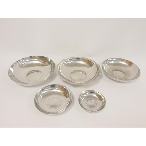 124 - Group of 1960s Lakeland Rural Industries (L.R.I), Borrowdale planished stainless steel bowls, the ce... 