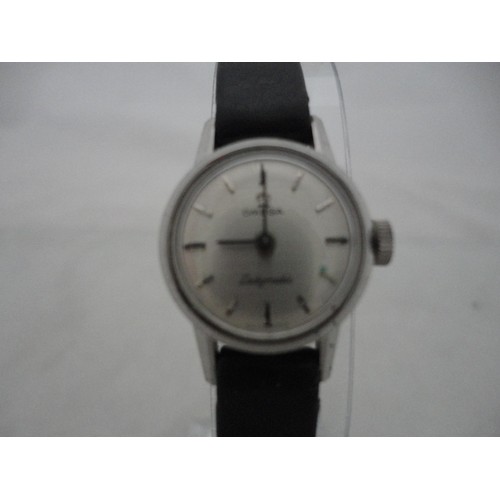 223 - Omega Ladymatic lady's watch with silvered dial and leather strap.