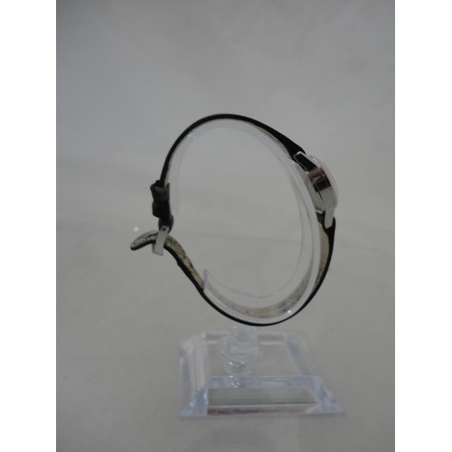 223 - Omega Ladymatic lady's watch with silvered dial and leather strap.