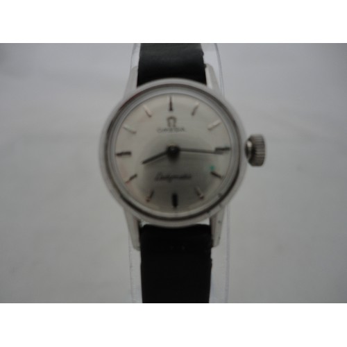 223 - Omega Ladymatic lady's watch with silvered dial and leather strap.