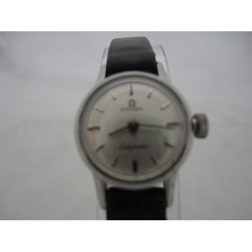 223 - Omega Ladymatic lady's watch with silvered dial and leather strap.