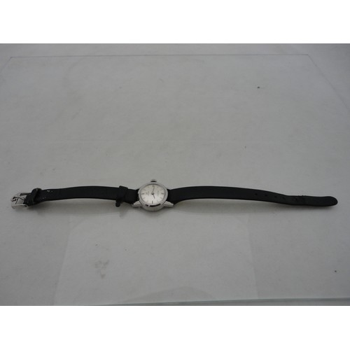 223 - Omega Ladymatic lady's watch with silvered dial and leather strap.