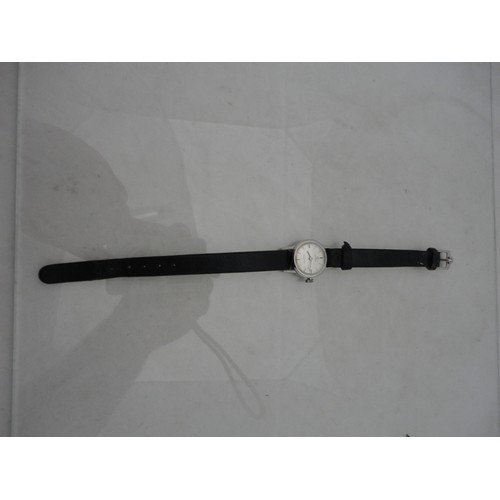 223 - Omega Ladymatic lady's watch with silvered dial and leather strap.