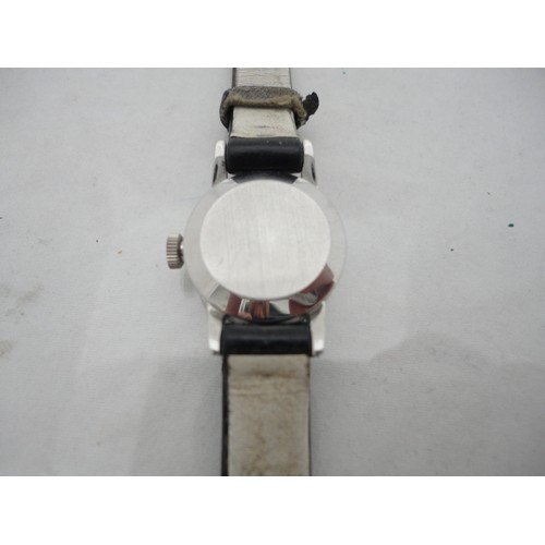 223 - Omega Ladymatic lady's watch with silvered dial and leather strap.
