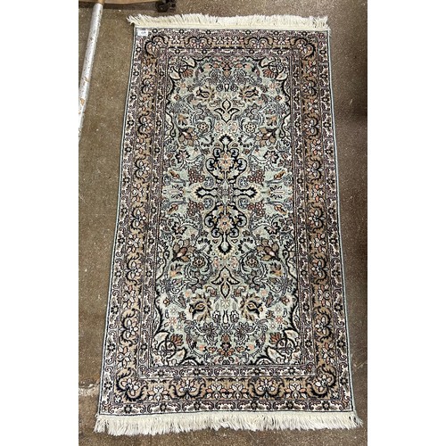 677 - Persian-style rug, 129cm x 71cm