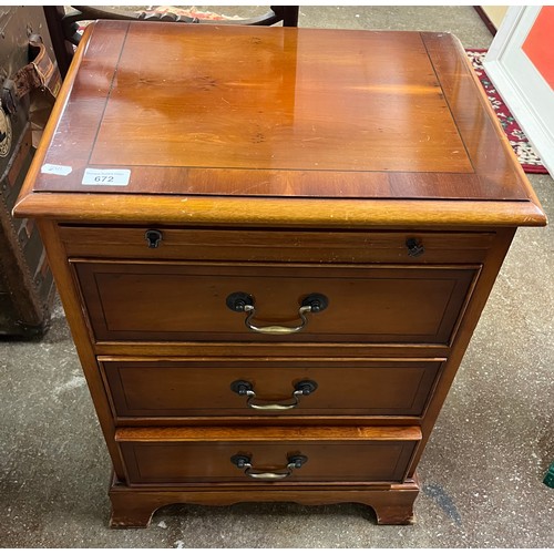 672 - Yew three drawer chest, 63cm high