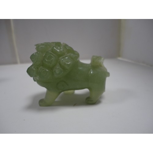 204 - Small Chinese-style jade-coloured censer and cover on stand, and a similar jade-coloured temple dog.... 