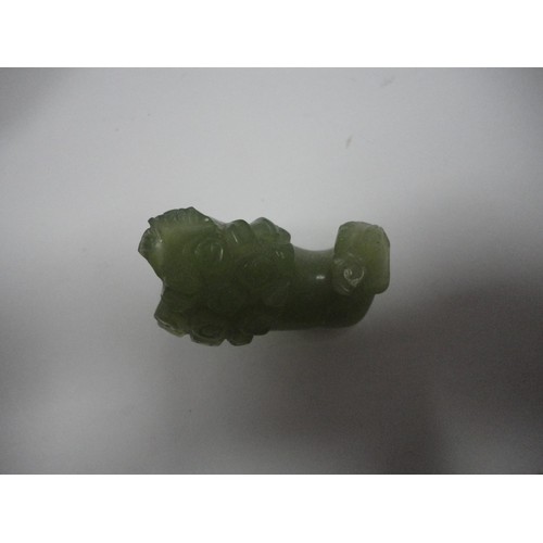 204 - Small Chinese-style jade-coloured censer and cover on stand, and a similar jade-coloured temple dog.... 