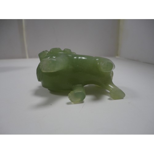 204 - Small Chinese-style jade-coloured censer and cover on stand, and a similar jade-coloured temple dog.... 