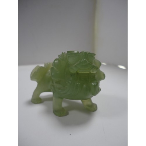 204 - Small Chinese-style jade-coloured censer and cover on stand, and a similar jade-coloured temple dog.... 