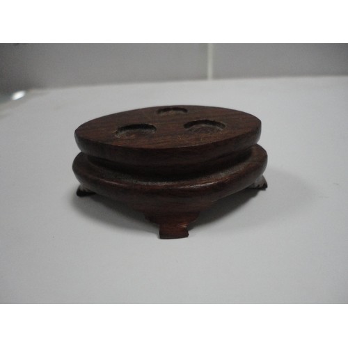 204 - Small Chinese-style jade-coloured censer and cover on stand, and a similar jade-coloured temple dog.... 