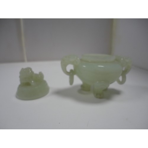 204 - Small Chinese-style jade-coloured censer and cover on stand, and a similar jade-coloured temple dog.... 