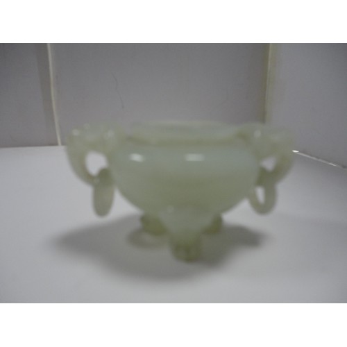 204 - Small Chinese-style jade-coloured censer and cover on stand, and a similar jade-coloured temple dog.... 