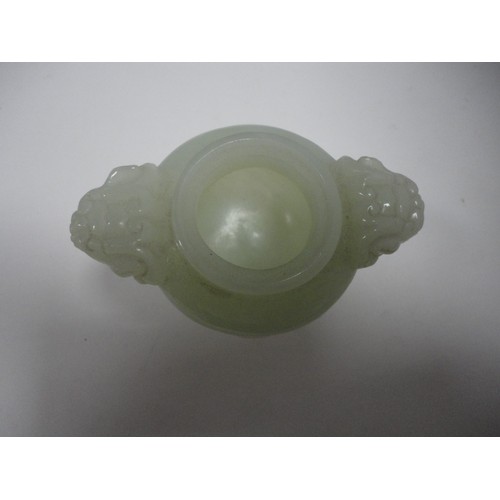 204 - Small Chinese-style jade-coloured censer and cover on stand, and a similar jade-coloured temple dog.... 