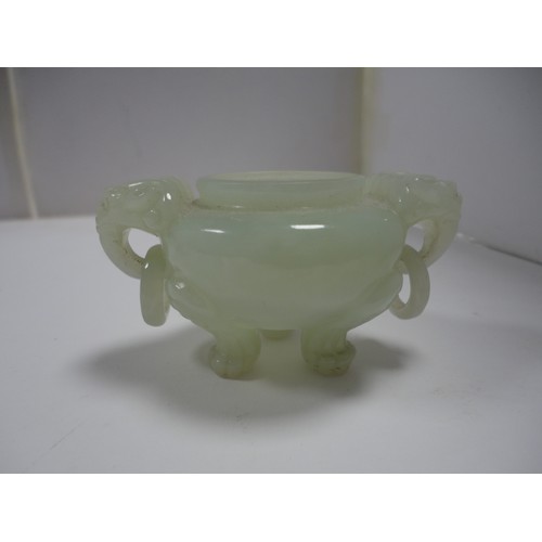 204 - Small Chinese-style jade-coloured censer and cover on stand, and a similar jade-coloured temple dog.... 