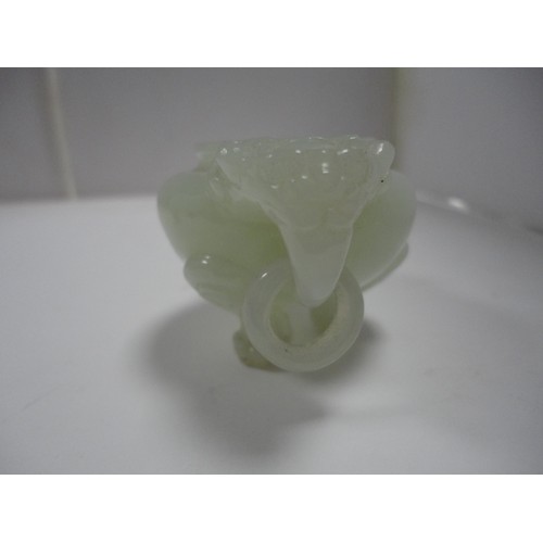 204 - Small Chinese-style jade-coloured censer and cover on stand, and a similar jade-coloured temple dog.... 