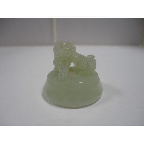 204 - Small Chinese-style jade-coloured censer and cover on stand, and a similar jade-coloured temple dog.... 