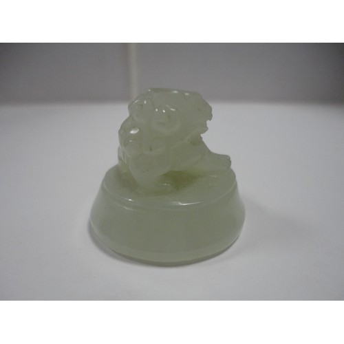 204 - Small Chinese-style jade-coloured censer and cover on stand, and a similar jade-coloured temple dog.... 