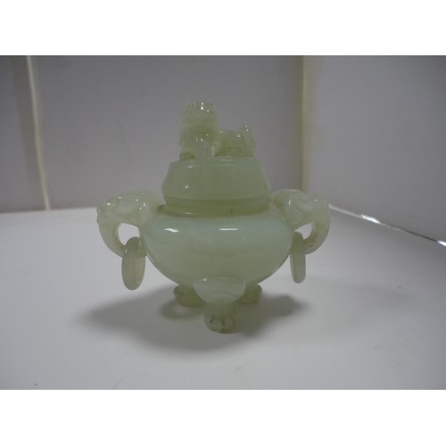 204 - Small Chinese-style jade-coloured censer and cover on stand, and a similar jade-coloured temple dog.... 
