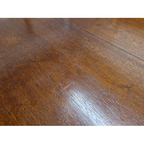 649 - William IV mahogany tip up rectangular center table, raised on central column on quadraform base rai... 