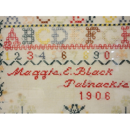 417 - Edwardian needlepoint sampler, worked by Maggie E Black, Palnackie 1906, with stitched alphabets abo... 