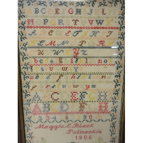 417 - Edwardian needlepoint sampler, worked by Maggie E Black, Palnackie 1906, with stitched alphabets abo... 