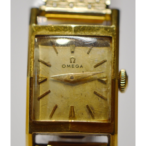 275 - Omega 18ct gold lady's watch, rectangular case, no. 3982, on rolled gold bracelet.