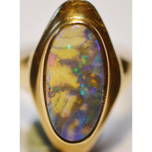 146 - Black opal ring in stepped 9ct gold setting, size M, 4.7g gross.