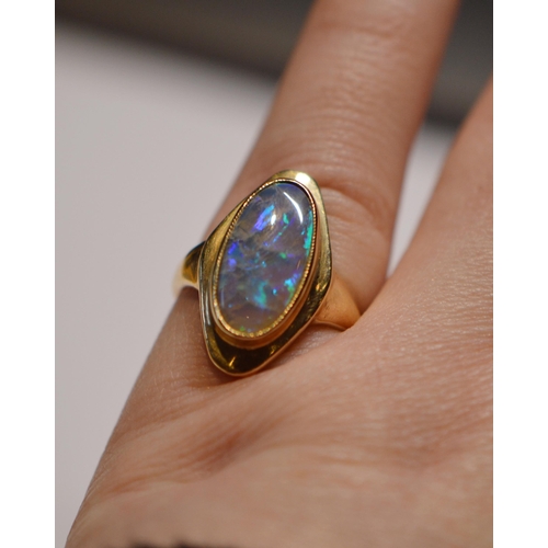 146 - Black opal ring in stepped 9ct gold setting, size M, 4.7g gross.