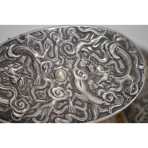 121 - Chinese silver export hand mirror with ring handle (late Qing dynasty), decorated with embossed drag... 