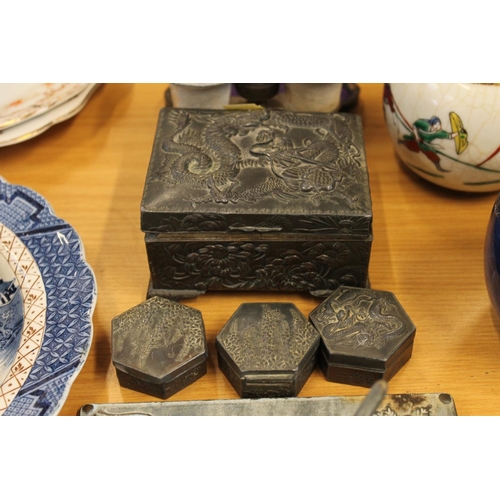 129 - Pair of opera glasses, an oriental metal hinge top jewellery casket decorated with dragon chasing pe... 