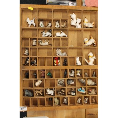 141 - Printers tray containing miniature cat models, etc.