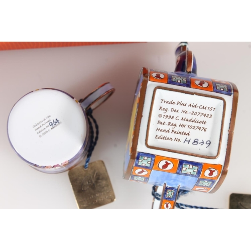 160 - Two Charlotte de Vita hand painted enamelled boxed items to include a cat decorated miniature teapot... 