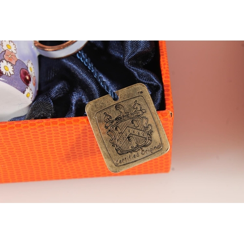 160 - Two Charlotte de Vita hand painted enamelled boxed items to include a cat decorated miniature teapot... 