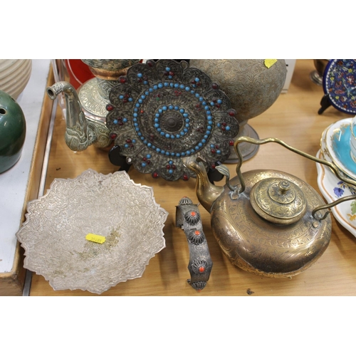 168 - Eastern metal ware to include and Indian rose water vase, a kettle, a Turkish style teapot, a Tibeta... 