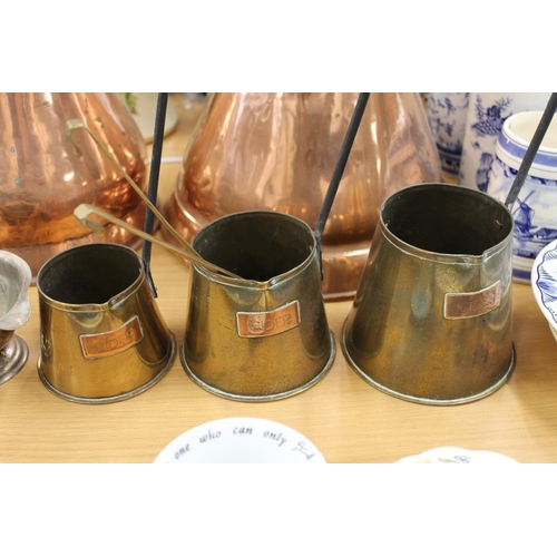 169 - Two copper harvest measures, three graduated cider measures, etc.
