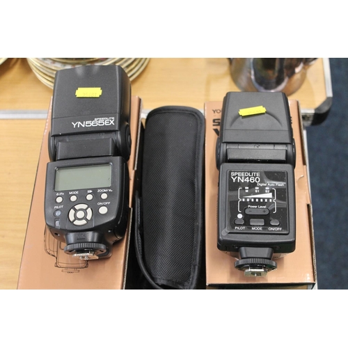 172 - Camera accessories to include two Yongnuo speed lghts, a Cobra flash outlet, memory cards, camera ba... 