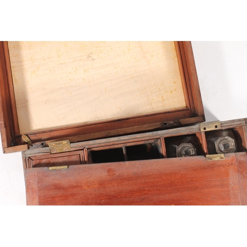 22 - Antique mahogany hinge top travelling box, the interior with fitted lift up boxes and compartments, ... 