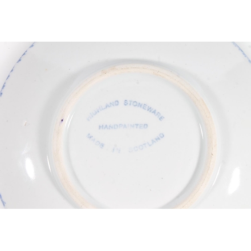 50 - Highland Stoneware saucer dish with painted design, 18cm diameter.