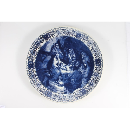 51 - Chemketa of Holland Delft blue and white charger dish, decorated with nativity scene, 34cm diameter.