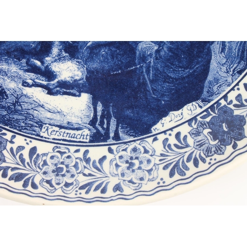 51 - Chemketa of Holland Delft blue and white charger dish, decorated with nativity scene, 34cm diameter.