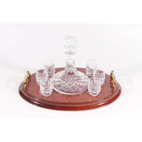 54 - Waterford Crystal cut-glass whisky set on stand with ship's style decanter and six barrel shaped sho... 