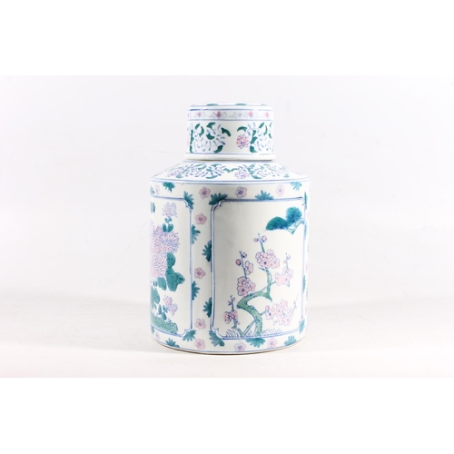 59 - Reproduction Chinese blue, white, green and pink decorated jar and cover, 31cm high.