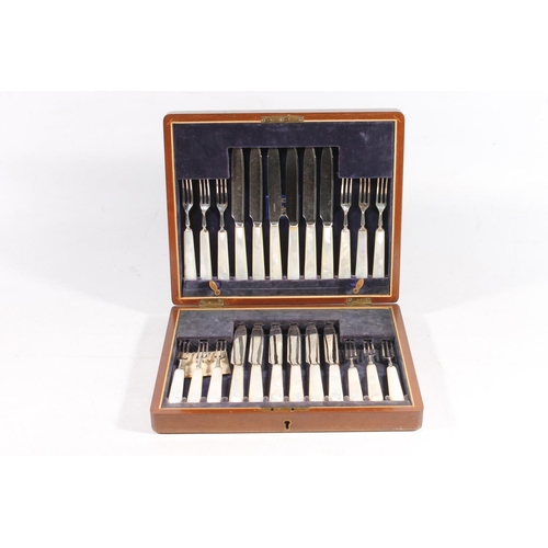 60 - Cased set of twelve mother-of-pearl handled fruit knives and forks, in fitted case, with label for D... 