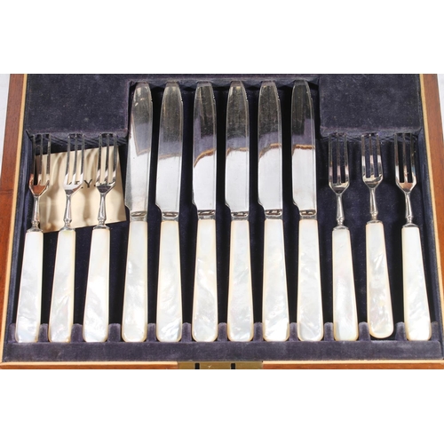 60 - Cased set of twelve mother-of-pearl handled fruit knives and forks, in fitted case, with label for D... 