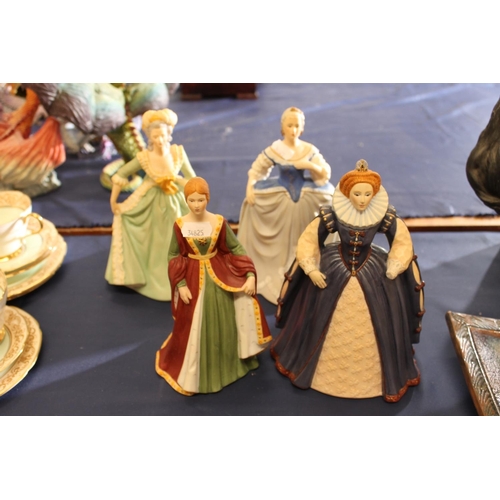Four Franklin Mint porcelain figurines to include Elizabeth